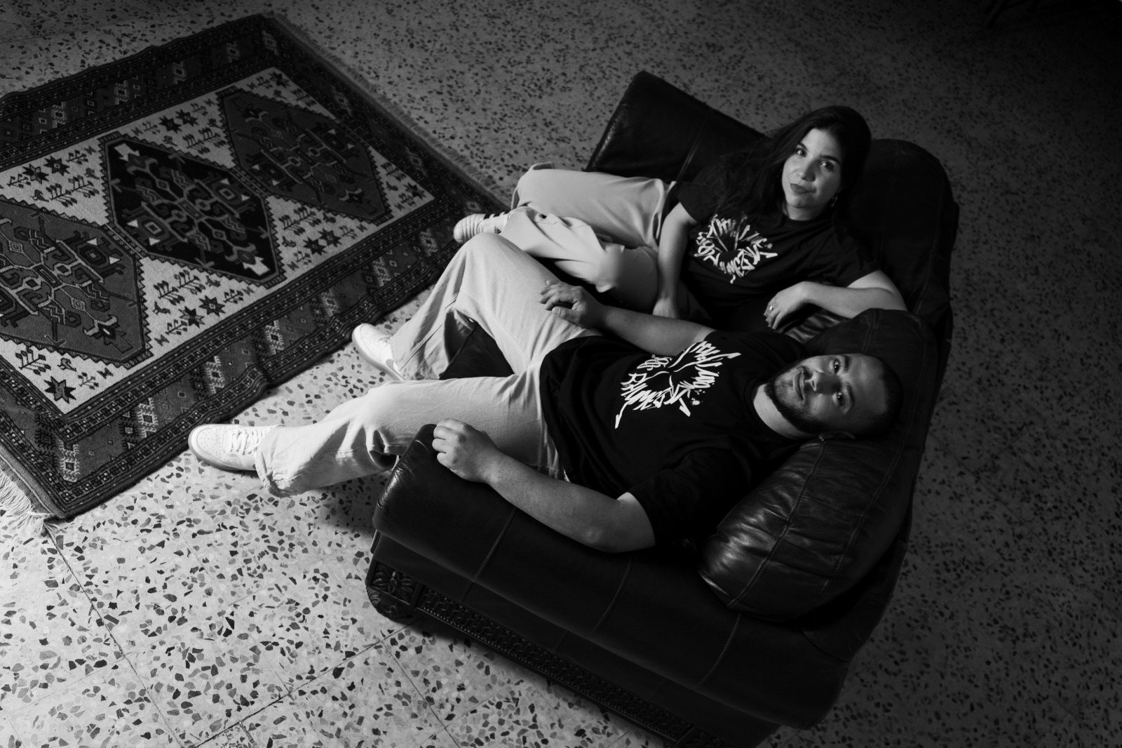 Nadia El-Hindi and Jamal Suleiman, co-founders of Cross Rhymez, on a sofa in Amman
